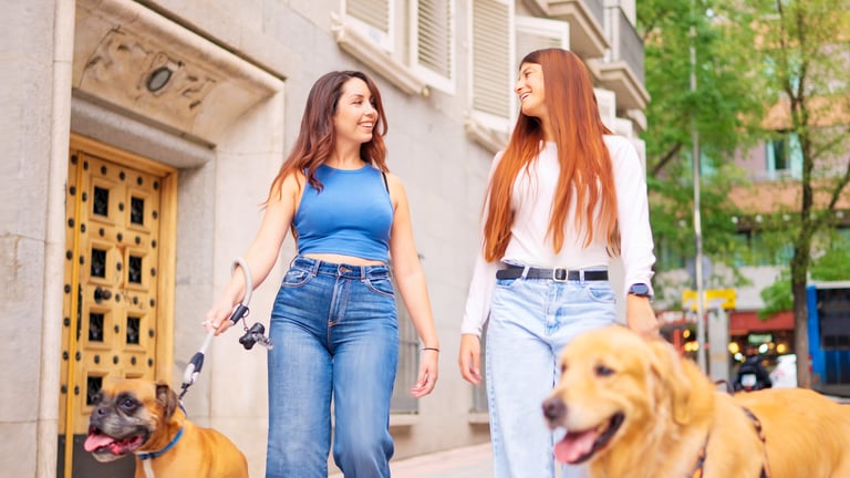 Resident walking dog in apartment community